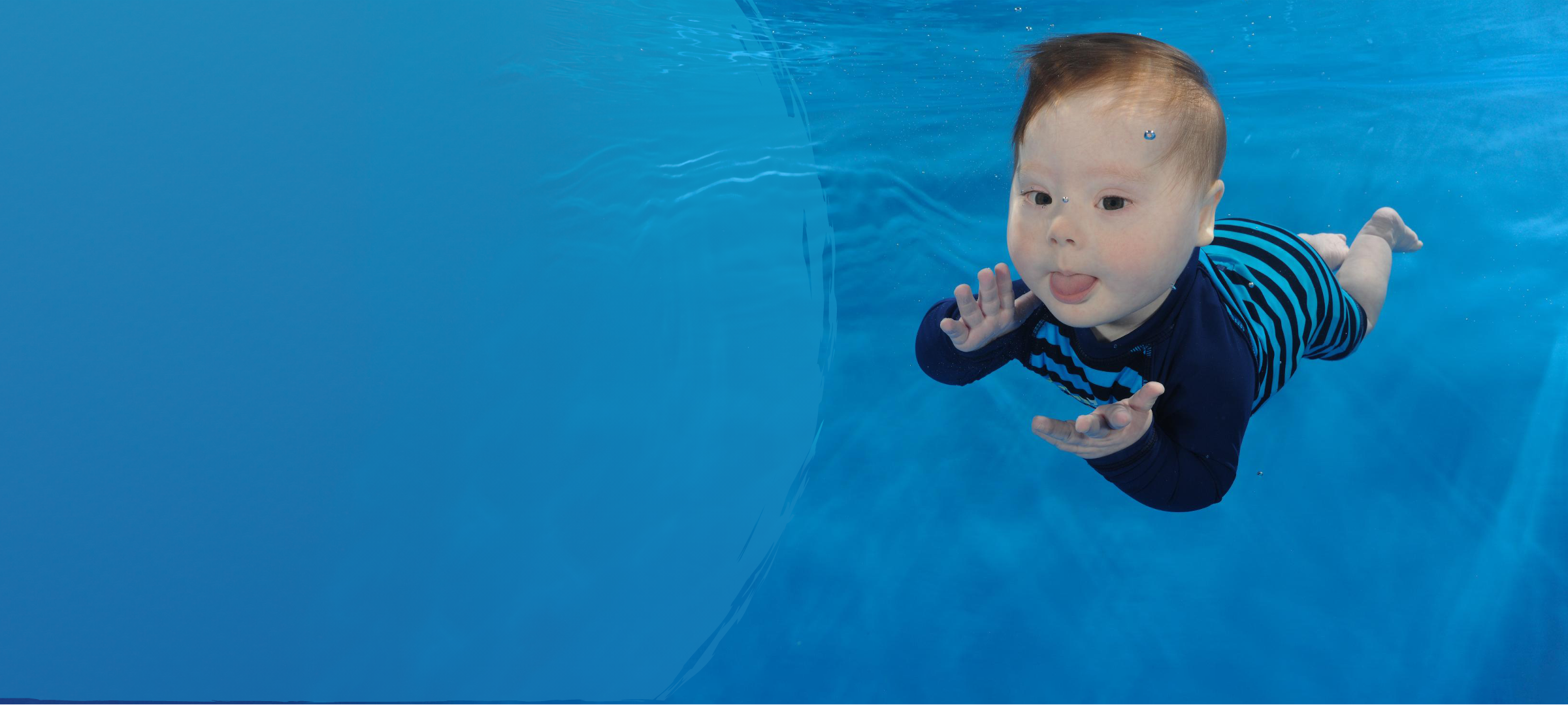 Baby swimming underwater